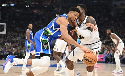 Jan 25, 2023; Milwaukee, Wisconsin, USA; Milwaukee Bucks forward Giannis Antetokounmpo (34) drives to the basket against Denver Nuggets forward Jeff Green (32) in the first half at Fiserv Forum. Mandatory Credit: Michael McLoone-USA TODAY Sports