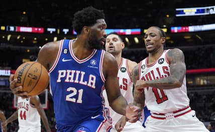 Oct 29, 2022; Chicago, Illinois, USA; Philadelphia 76ers center Joel Embiid (21) is defended by Chicago Bulls forward DeMar DeRozan (11) during the second half at United Center. Mandatory Credit: David Banks-USA TODAY Sports