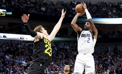 Mar 7, 2023; Dallas, Texas, USA;  Dallas Mavericks guard Kyrie Irving (2) shoots over Utah Jazz forward Lauri Markkanen (23) during the fourth quarter at American Airlines Center. Mandatory Credit: Kevin Jairaj-USA TODAY Sports