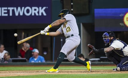 Apr 21, 2023; Arlington, Texas, USA;  Oakland Athletics second baseman Jordan Diaz (13) hits a home run during the ninth inning against the Texas Rangers at Globe Life Field. Mandatory Credit: Kevin Jairaj-USA TODAY Sports