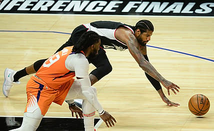 Jun 24, 2021; Los Angeles, California, USA; Los Angeles Clippers guard Paul George (13) plays for the ball against Phoenix Suns forward Jae Crowder (99) during the second half in game three of the Western Conference Finals for the 2021 NBA Playoffs at Staples Center. Mandatory Credit: Gary A. Vasquez-USA TODAY Sports