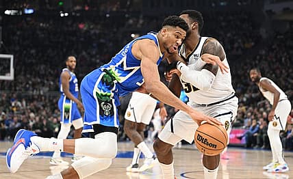 Jan 25, 2023; Milwaukee, Wisconsin, USA; Milwaukee Bucks forward Giannis Antetokounmpo (34) drives to the basket against Denver Nuggets forward Jeff Green (32) in the first half at Fiserv Forum. Mandatory Credit: Michael McLoone-USA TODAY Sports