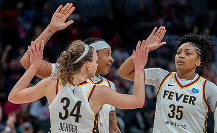 Grace Berger, Emma Cannon and Victoria Vivians celebrate after Berger made a basket during their game against the New York Liberty Wednesday, July 12, 2023 in Gainbridge Fieldhouse in Indianapolis.