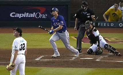 Oct 30, 2023; Phoenix, AZ, USA; Texas Rangers shortstop Corey Seager (5) hits a two-run home off Arizona Diamondbacks pitcher Brandon Pfaadt (32) during the third inning in game three of the 2023 World Series at Chase Field. Mandatory Credit: Rick Scuteri-USA TODAY Sports