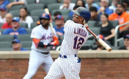 Jul 11, 2021; New York City, New York, USA; New York Mets shortstop Francisco Lindor (12) hits a two-run home run against the Pittsburgh Pirates during the first inning at Citi Field. Mandatory Credit: Andy Marlin-USA TODAY Sports