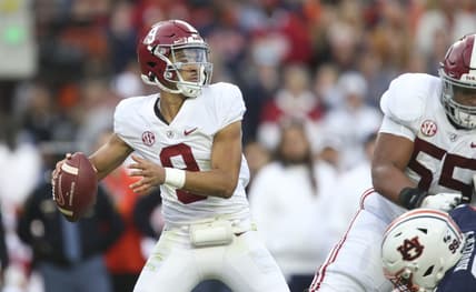 Nov 27, 2021; Auburn, Alabama, USA;  Alabama Crimson Tide quarterback Bryce Young (9) throws against the Auburn Tigers during the first half at Jordan-Hare Stadium. Mandatory Credit: Gary Cosby Jr.-USA TODAY Sports