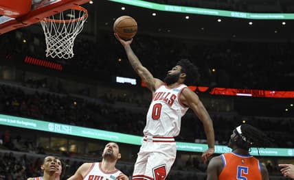 Feb 12, 2022; Chicago, Illinois, USA;  Chicago Bulls guard Coby White (0) shoots the ball against the Oklahoma City Thunder during the first half at the United Center. Mandatory Credit: Matt Marton-USA TODAY Sports