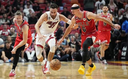 Oct 19, 2022; Miami, Florida, USA; Chicago Bulls guard Goran Dragic (7) tips the ball away from Miami Heat guard Max Strus (31) as guard Alex Caruso (6) follows on the play in the second half at FTX Arena. Mandatory Credit: Jim Rassol-USA TODAY Sports