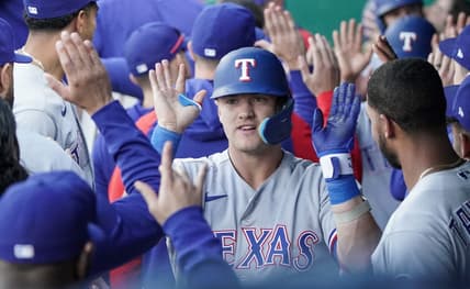Apr 17, 2023; Kansas City, Missouri, USA; Texas Rangers third baseman Josh Jung (6) is congratulated in the dugout after hitting a three run home run against the Kansas City Royals in the first inning at Kauffman Stadium. Mandatory Credit: Denny Medley-USA TODAY Sports