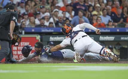 Jul 29, 2023; Houston, Texas, USA; Tampa Bay Rays shortstop Wander Franco (5) is out on a play at home plate as Houston Astros catcher Yainer Diaz (21) applies a tag during the first inning at Minute Maid Park. Mandatory Credit: Troy Taormina-USA TODAY Sports