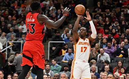 Dec 13, 2023; Toronto, Ontario, CAN;   Atlanta Hawks forward Onyeka Okongwu (17) shoots the ball as Toronto Raptors forward Pascal Siakam (43) defends in the first half at Scotiabank Arena. Mandatory Credit: Dan Hamilton-USA TODAY Sports