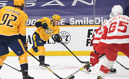 Mar 25, 2021; Nashville, Tennessee, USA; Nashville Predators right wing Eeli Tolvanen (28) scores on the power play during the first period against the Detroit Red Wings at Bridgestone Arena. Mandatory Credit: Christopher Hanewinckel-USA TODAY Sports