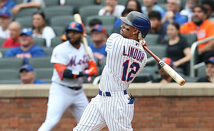 Jul 11, 2021; New York City, New York, USA; New York Mets shortstop Francisco Lindor (12) hits a two-run home run against the Pittsburgh Pirates during the first inning at Citi Field. Mandatory Credit: Andy Marlin-USA TODAY Sports
