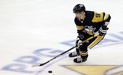 Nov 4, 2021; Pittsburgh, Pennsylvania, USA;  Pittsburgh Penguins center Evan Rodrigues (9) skates with the puck against the Philadelphia Flyers during the second period at PPG Paints Arena. Mandatory Credit: Charles LeClaire-USA TODAY Sports