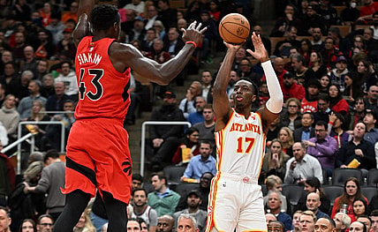 Dec 13, 2023; Toronto, Ontario, CAN;   Atlanta Hawks forward Onyeka Okongwu (17) shoots the ball as Toronto Raptors forward Pascal Siakam (43) defends in the first half at Scotiabank Arena. Mandatory Credit: Dan Hamilton-USA TODAY Sports