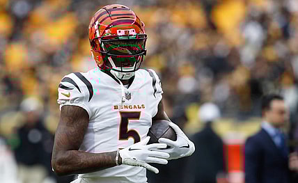 Dec 23, 2023; Pittsburgh, Pennsylvania, USA;  Cincinnati Bengals wide receiver Tee Higgins (5) warms up before the game against the Pittsburgh Steelers at Acrisure Stadium. Mandatory Credit: Charles LeClaire-USA TODAY Sports