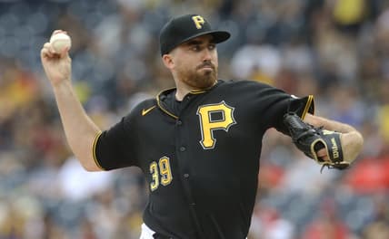 Aug 21, 2022; Pittsburgh, Pennsylvania, USA; Pittsburgh Pirates starting pitcher Zach Thompson (39) delivers a pitch against the Cincinnati Reds during the first inning at PNC Park. Mandatory Credit: Charles LeClaire-USA TODAY Sports