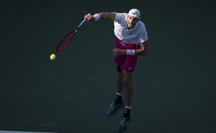 Aug 19, 2022; Cincinnati, OH, USA; John Isner (USA) serves the ball during his match against Stefanos Tsitsipas (GRE) at the Western & Southern Open at the Lindner Family Tennis Center. Mandatory Credit: Susan Mullane-USA TODAY Sports
