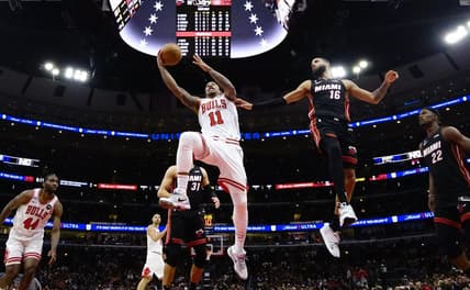 Mar 18, 2023; Chicago, Illinois, USA; Miami Heat forward Caleb Martin (16) defends Chicago Bulls forward DeMar DeRozan (11) during the second half at United Center. Mandatory Credit: David Banks-USA TODAY Sports