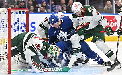 Oct 14, 2023; Toronto, Ontario, CAN;  Minnesota Wild goalie Filip Gustavsson (32) makes a save against Toronto Maple Leafs forward Fraser Minten (39) in the first period at Scotiabank Arena. Mandatory Credit: Dan Hamilton-USA TODAY Sports
