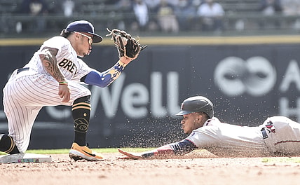 Apr 4, 2021; Milwaukee, Wisconsin, USA; Milwaukee Brewers second baseman Kolten Wong (16) gets ready to tag out Minnesota Twins second baseman Jorge Polanco (11) trying to steal 2nd base in the third inning at American Family Field. Mandatory Credit: Benny Sieu-USA TODAY Sports