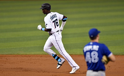 Jun 22, 2021; Miami, Florida, USA;  Miami Marlins outfielder Jesus Sanchez (76) rounds the bases after hitting a solo home run off of Toronto Blue Jays pitcher Ross Stripling (48) in the second inning at loanDepot Park. Mandatory Credit: Jim Rassol-USA TODAY Sports