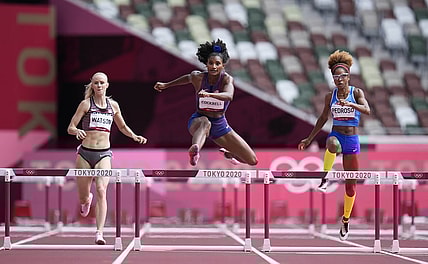 Jul 31, 2021; Tokyo, Japan; From left Sage Watson (CAN), Anna Cockrell (USA) and Yadisleidis Pedroso (ITA) race in the women's 400m hurdles round 1 during the Tokyo 2020 Olympic Summer Games at Olympic Stadium. Mandatory Credit: James Lang-USA TODAY Sports