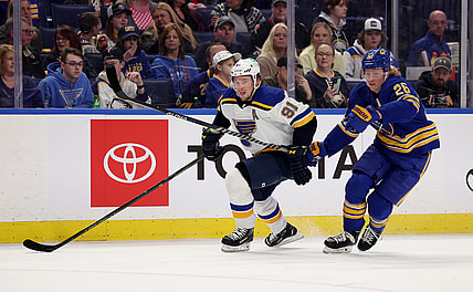 Apr 14, 2022; Buffalo, New York, USA;  St. Louis Blues right wing Vladimir Tarasenko (91) and Buffalo Sabres defenseman Rasmus Dahlin (26) looks for the puck during the first period at KeyBank Center. Mandatory Credit: Timothy T. Ludwig-USA TODAY Sports