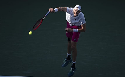 Aug 19, 2022; Cincinnati, OH, USA; John Isner (USA) serves the ball during his match against Stefanos Tsitsipas (GRE) at the Western & Southern Open at the Lindner Family Tennis Center. Mandatory Credit: Susan Mullane-USA TODAY Sports