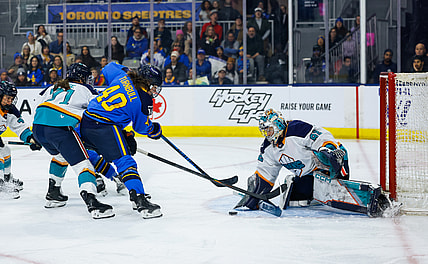 New York Sirens goalie Kayle Osborne makes a save on Toronto Sceptres forward Blayre Turnbull.