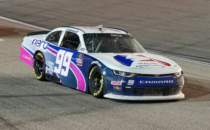 Oct 17, 2020; Kansas City, Kansas, USA; NASCAR Xfinity Series driver Jesse Iwuji (99) races during the Kansas Lottery 300 at Kansas Speedway. Mandatory Credit: Jay Biggerstaff-USA TODAY Sports