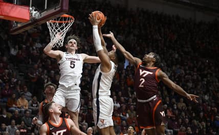 Feb 4, 2023; Blacksburg, Virginia, USA; Virginia Cavaliers forward Jayden Gardner (1) drives to basket as Virginia Tech Hokies guard Michael Collins Jr. (2) defends at Cassell Coliseum in the first half. Mandatory Credit: Lee Luther Jr.-USA TODAY Sports