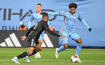 Mar 18, 2023; New York, New York, USA; New York City FC forward Talles Magno (43) dribbles the ball defended by D.C. United defender Ruan (2) during the first half at Yankee Stadium. Mandatory Credit: Mark Smith-USA TODAY Sports