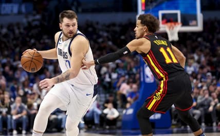 Jan 18, 2023; Dallas, Texas, USA;  Dallas Mavericks guard Luka Doncic (77) drives to the basket as Atlanta Hawks guard Trae Young (11) defends during the second half at American Airlines Center. Mandatory Credit: Kevin Jairaj-USA TODAY Sports