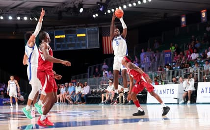 Nov 23, 2023; Paradise Island, BAHAMAS; Memphis Tigers forward David Jones (8) scores over Arkansas Razorbacks forward Chandler Lawson (8) right before halftime at Imperial Arena. Mandatory Credit: Kevin Jairaj-USA TODAY Sports