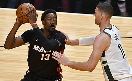 May 27, 2021; Miami, Florida, USA; Milwaukee Bucks center Brook Lopez (11) defends Miami Heat center Bam Adebayo (13) in the first half during game three in the first round of the 2021 NBA Playoffs at American Airlines Arena. Mandatory Credit: Jim Rassol-USA TODAY Sports
