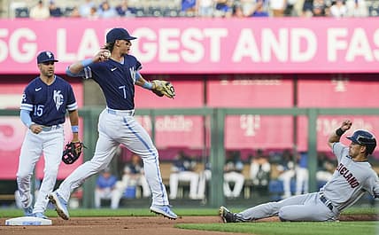 Jul 8, 2022; Kansas City, Missouri, USA; Kansas City Royals shortstop Bobby Witt Jr. (7) throws to first base after forcing out Cleveland Guardians left fielder Steven Kwan (38) during the first inning at Kauffman Stadium. Mandatory Credit: Jay Biggerstaff-USA TODAY Sports