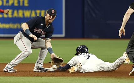 Sep 5, 2022; St. Petersburg, Florida, USA; Tampa Bay Rays second baseman Vidal Brujan (7) steals second base as Boston Red Sox second baseman Trevor Story (10) attempted to tag him out during the seventh inning at Tropicana Field. Mandatory Credit: Kim Klement-USA TODAY Sports