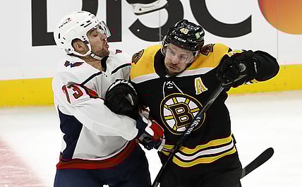 Mar 3, 2021; Boston, Massachusetts, USA; Boston Bruins center David Krejci (46) collides with Washington Capitals left wing Conor Sheary (73) during the second period at TD Garden. Mandatory Credit: Winslow Townson-USA TODAY Sports