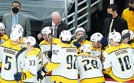 Mar 28, 2021; Chicago, Illinois, USA; Nashville Predators head coach John Hynes talks with his team during the third period at United Center. Mandatory Credit: David Banks-USA TODAY Sports