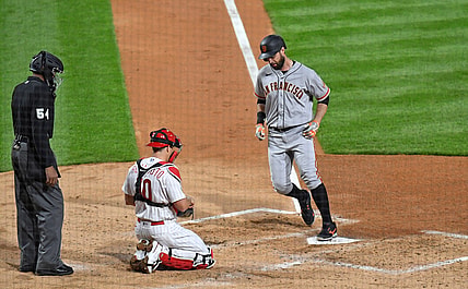 Apr 19, 2021; Philadelphia, Pennsylvania, USA; San Francisco Giants first baseman Brandon Belt (9) steps on home plate after hitting a 2-run home run during the third inning against the Philadelphia Phillies at Citizens Bank Park. Mandatory Credit: Eric Hartline-USA TODAY Sports