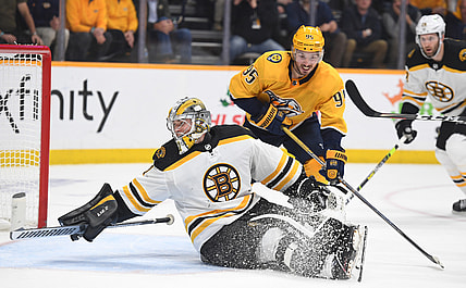 Dec 2, 2021; Nashville, Tennessee, USA; Boston Bruins goaltender Jeremy Swayman (1) looks behind him for the puck after a save on a play by Nashville Predators center Matt Duchene (95) during the third period at Bridgestone Arena. Mandatory Credit: Christopher Hanewinckel-USA TODAY Sports
