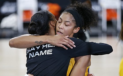 Sep 17, 2020; Palmetto, Florida, USA;  Los Angeles Sparks forward Candace Parker (3) and Connecticut Sun forward DeWanna Bonner (24) hug after the game at the FELD entertainment complex. Mandatory Credit: Reinhold Matay-USA TODAY Sports