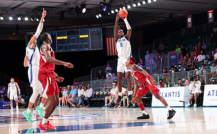 Nov 23, 2023; Paradise Island, BAHAMAS; Memphis Tigers forward David Jones (8) scores over Arkansas Razorbacks forward Chandler Lawson (8) right before halftime at Imperial Arena. Mandatory Credit: Kevin Jairaj-USA TODAY Sports