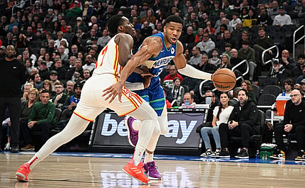 Dec 2, 2023; Milwaukee, Wisconsin, USA; Milwaukee Bucks forward Giannis Antetokounmpo (34) drives the baseline against Atlanta Hawks forward Onyeka Okongwu (17) in the first half at Fiserv Forum. Mandatory Credit: Michael McLoone-USA TODAY Sports