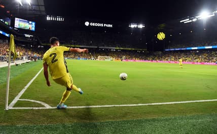 Oct 2, 2022; Nashville, Tennessee, USA; Nashville SC defender Daniel Lovitz (2) kicks a corner kick during the first half against the Houston Dynamo at Geodis Park. Mandatory Credit: Christopher Hanewinckel-USA TODAY Sports