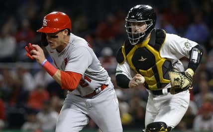 Oct 3, 2022; Pittsburgh, Pennsylvania, USA;  St. Louis Cardinals right fielder Lars Nootbaar (left) is chased during a run down between third base and home plate by Pittsburgh Pirates catcher Jason Delay (right) during the fourth inning at PNC Park. Mandatory Credit: Charles LeClaire-USA TODAY Sports