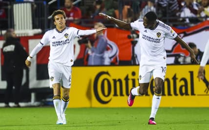 Mar 4, 2023; Frisco, Texas, USA;  Los Angeles Galaxy midfielder Riqui Puig (6) celebrates with Los Angeles Galaxy defender Kelvin Leerdam (18) after scoring a goal during the first half against FC Dallas at Toyota Stadium. Mandatory Credit: Kevin Jairaj-USA TODAY Sports