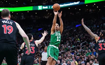 Apr 5, 2023; Boston, Massachusetts, USA; Boston Celtics guard Malcolm Brogdon (13) shoots the ball against Toronto Raptors guard Fred VanVleet (23) in the second half at TD Garden. Mandatory Credit: David Butler II-USA TODAY Sports