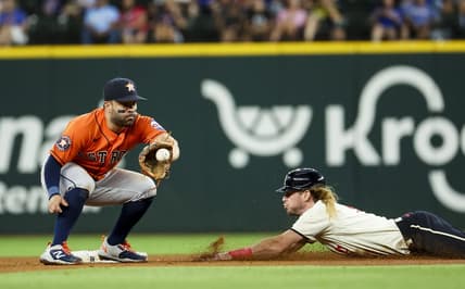 Jul 1, 2023; Arlington, Texas, USA;  Texas Rangers left fielder Travis Jankowski (16) steals second base ahead of the tag by Houston Astros second baseman Jose Altuve (27) during the fourth inning at Globe Life Field. Mandatory Credit: Kevin Jairaj-USA TODAY Sports